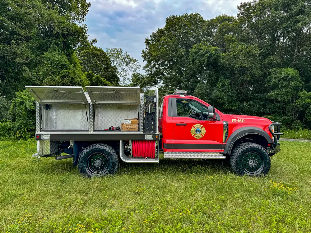 Left-side view with upper compartment doors raised open.