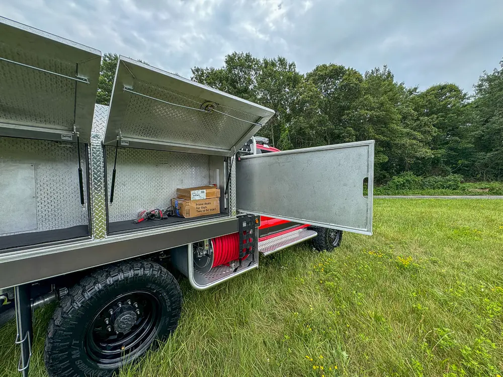 Right-side compartments open with mid-body door swung outward.