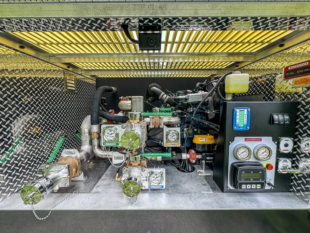 Open rear pump area with control panel and plumbing visible.