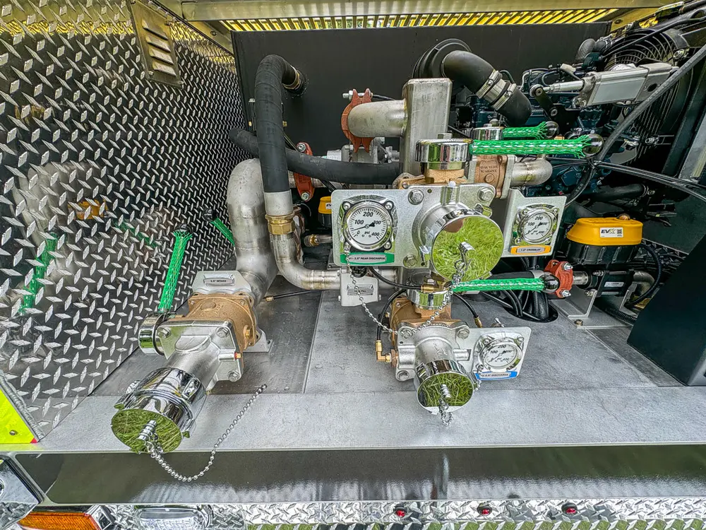 Pump compartment close-up with valves, piping, and pump components.