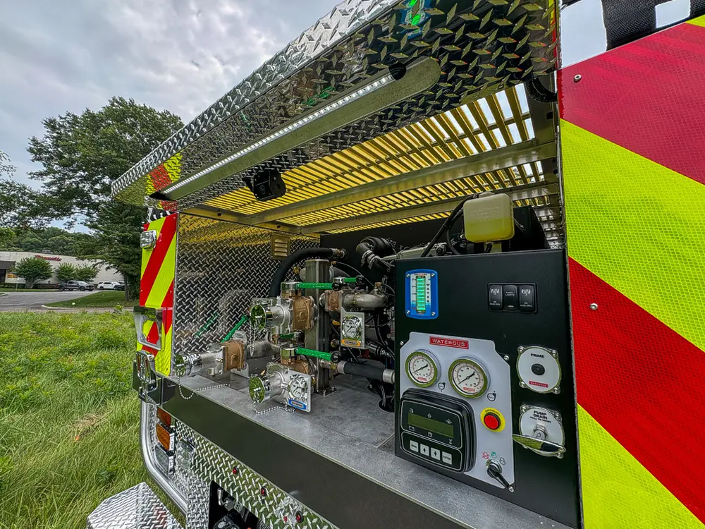 Rear pump bay angled view showing control panel and equipment layout.