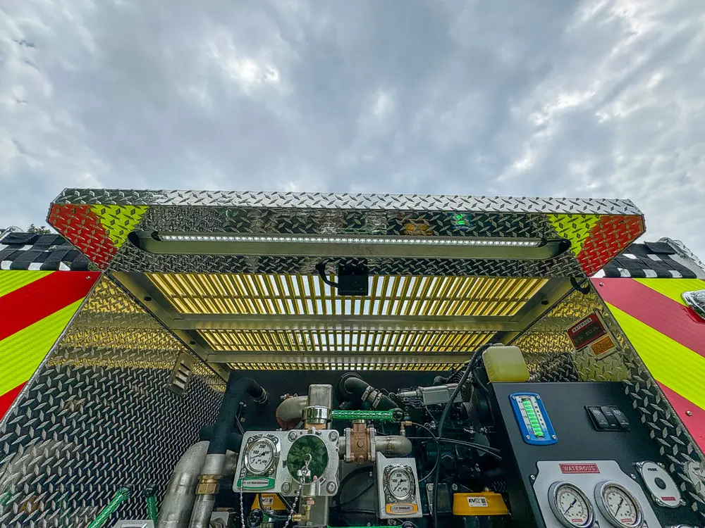 Top rear view into pump bay under the open upper hatch.