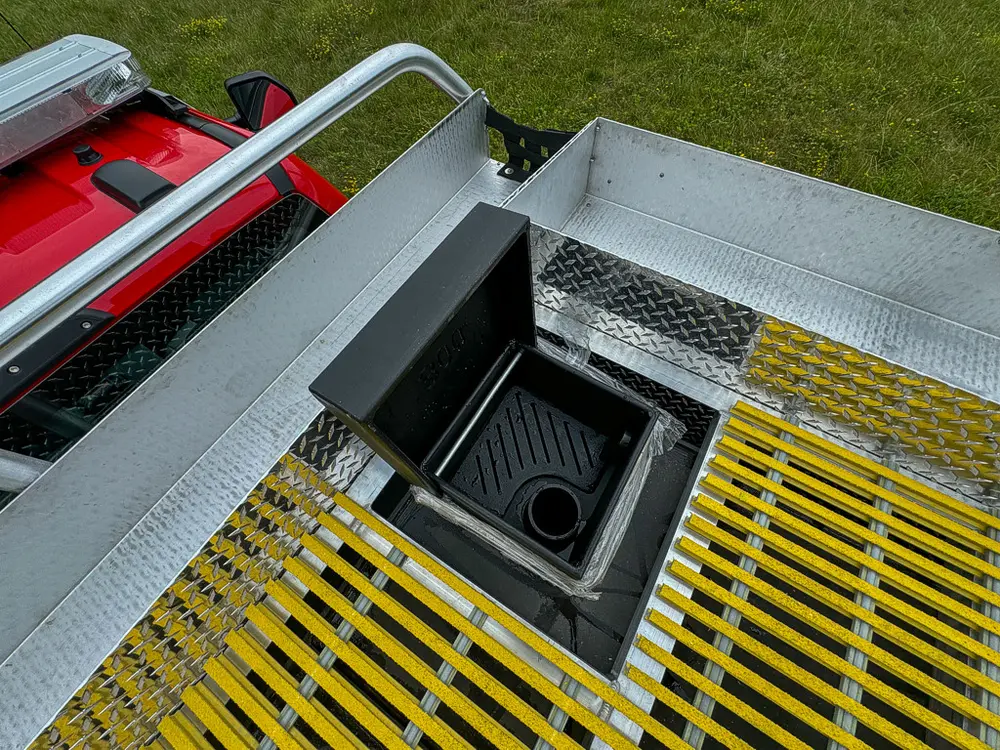 Top deck side with open service hatch and recessed compartment.