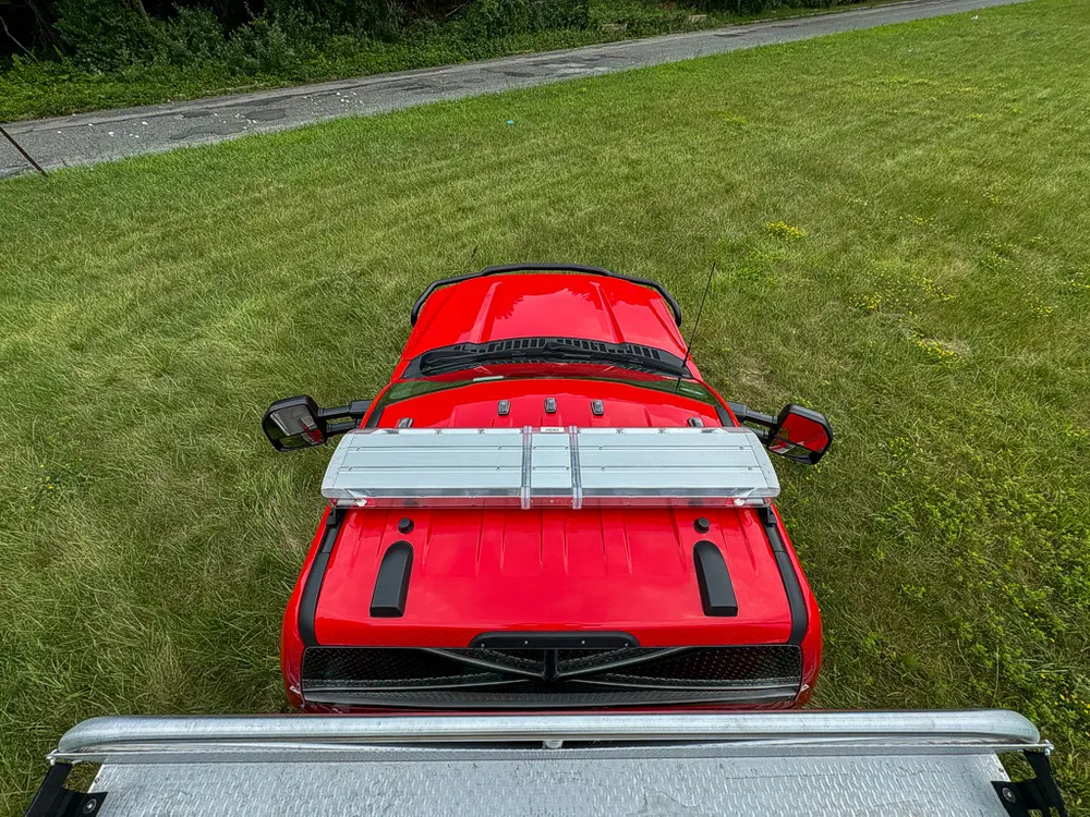 Rear-to-front view along top deck with red cab roof visible.