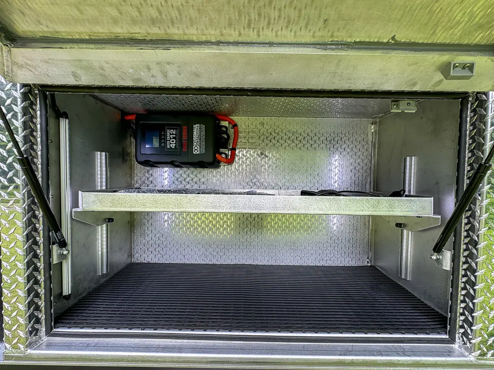 Open side compartment with two shelves and clean empty interior.