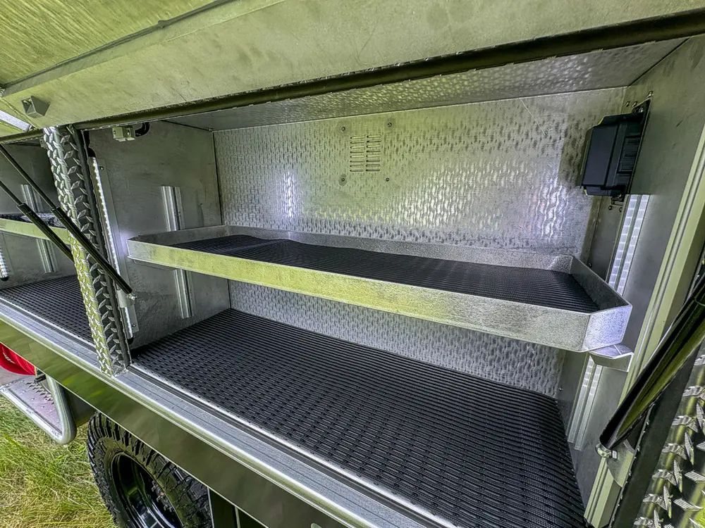 Open compartment close-up showing shelf and blank rear wall.