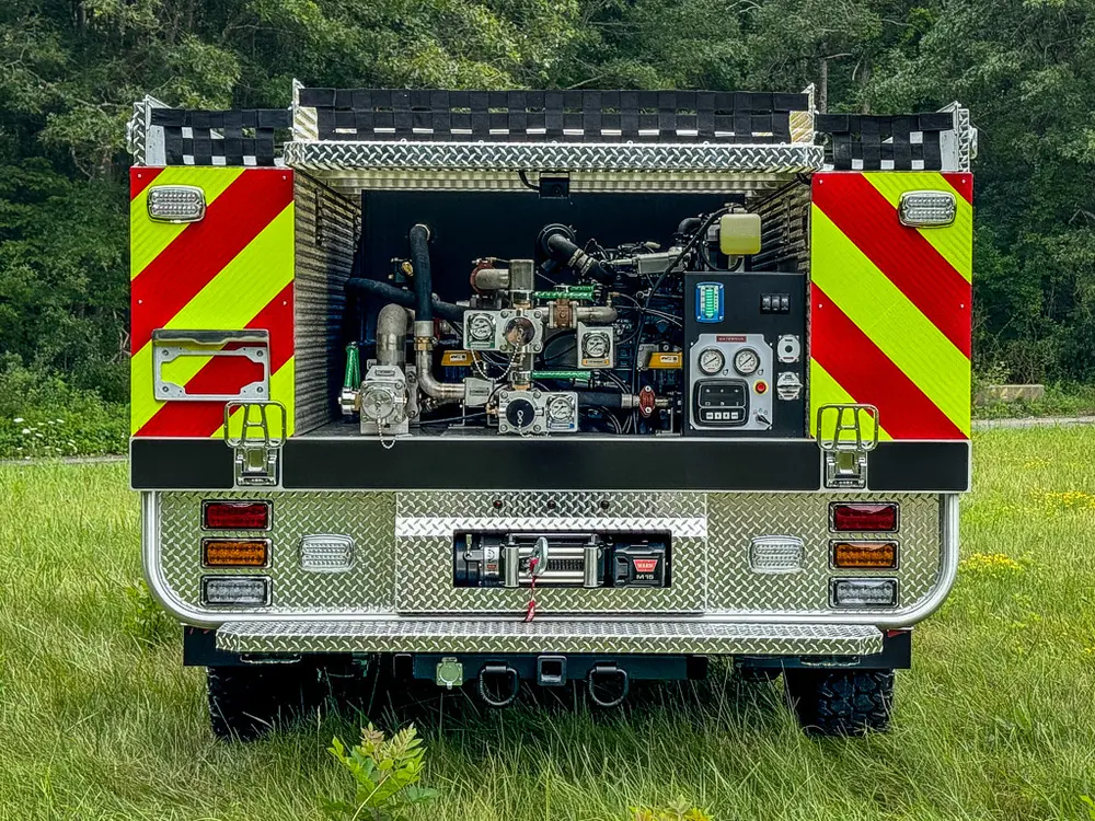 Straight rear view of open pump control panel with chevron-striped corners.
