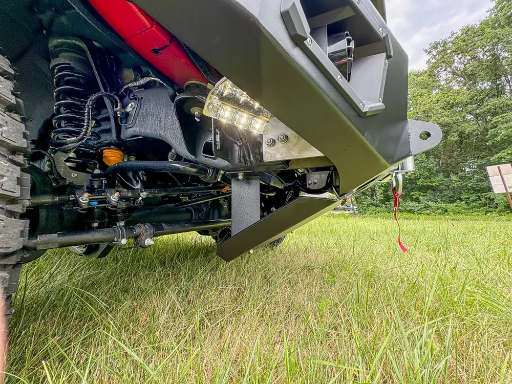Underside front suspension and bumper support close-up.