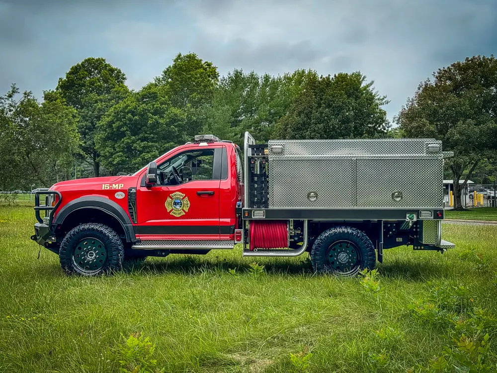 Left-side view with utility body and side compartments closed.