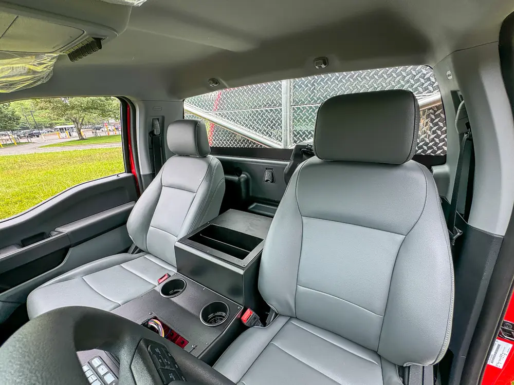 Front seats and center console view from passenger side.