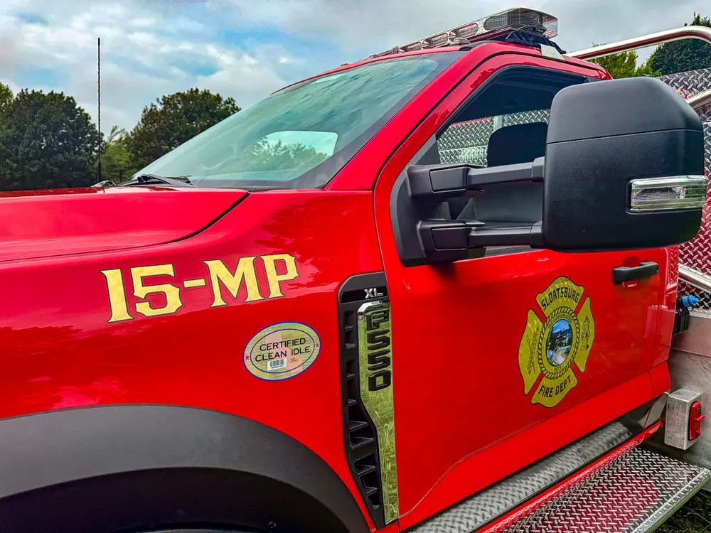 Driver-side door close-up with 15-MP marking and department emblem.
