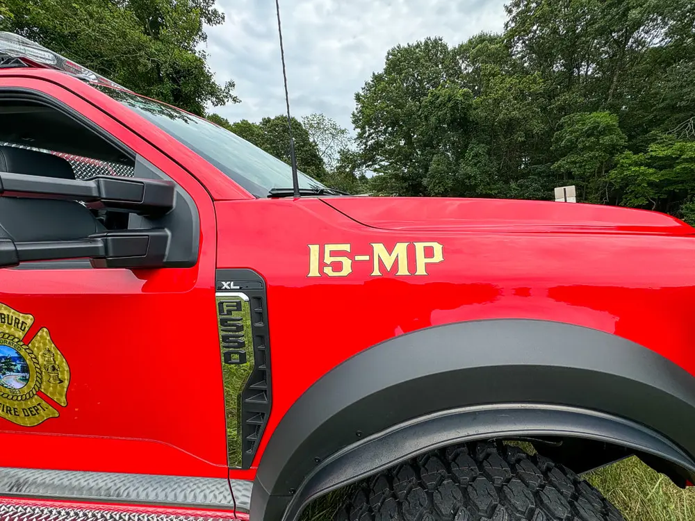 Side body close-up showing 15-MP lettering above front wheel arch.