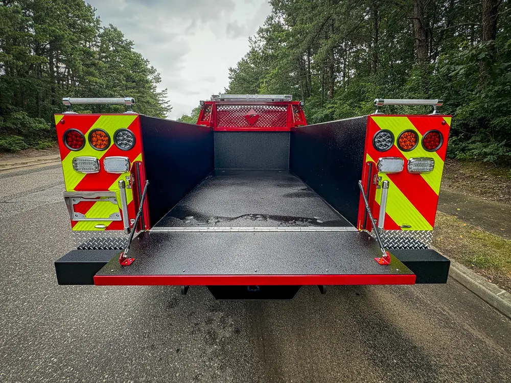 Open rear cargo bed view with tailgate lowered flat.