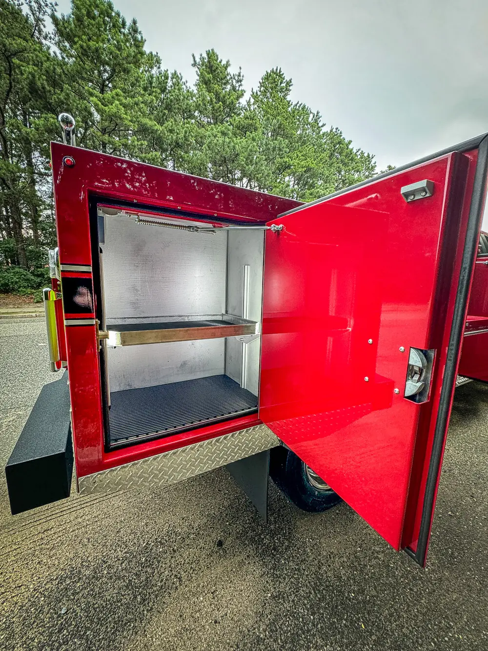 Open right-side rear compartment with shelving and clean interior.