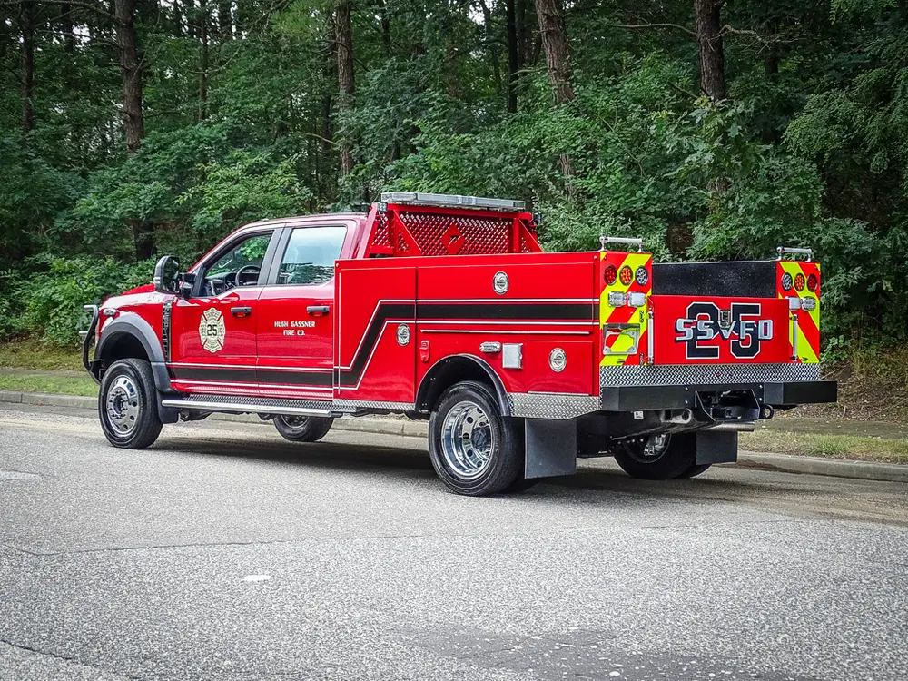 Rear-left three-quarter view with side body and rear panel visible.