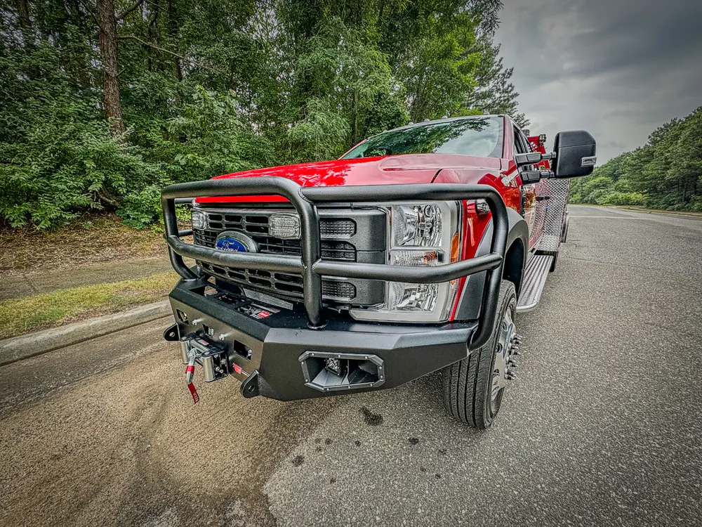 Front-left three-quarter view focusing on grille guard and bumper.
