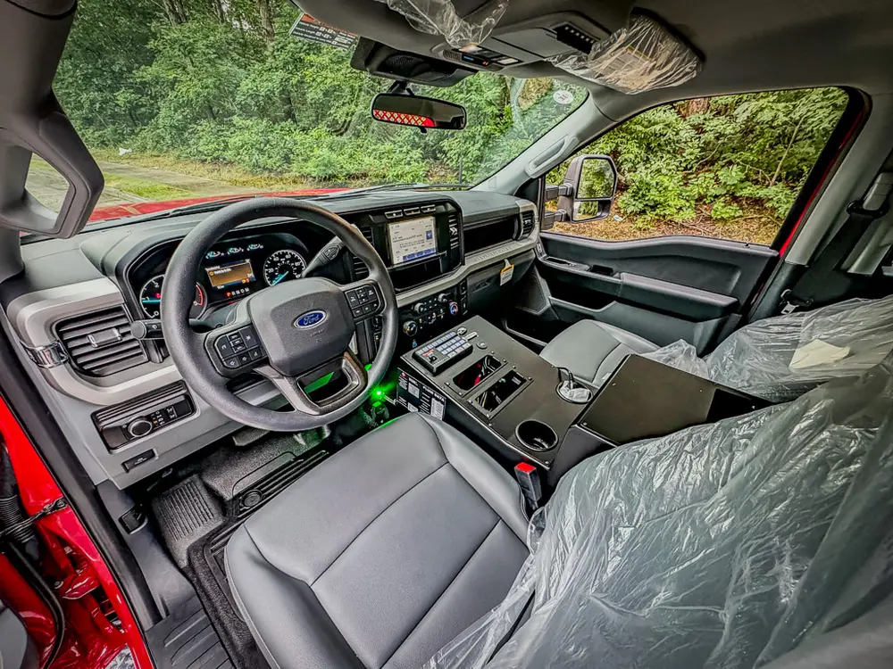 Front cabin interior view with dashboard and center console.