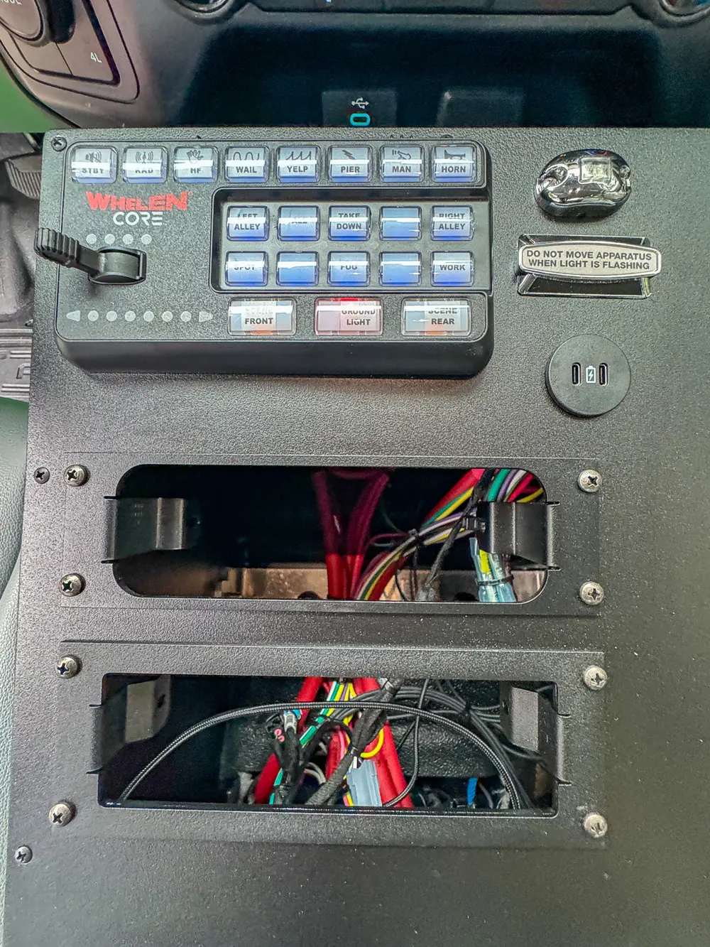 Control panel close-up showing wiring bay and toggle switches.