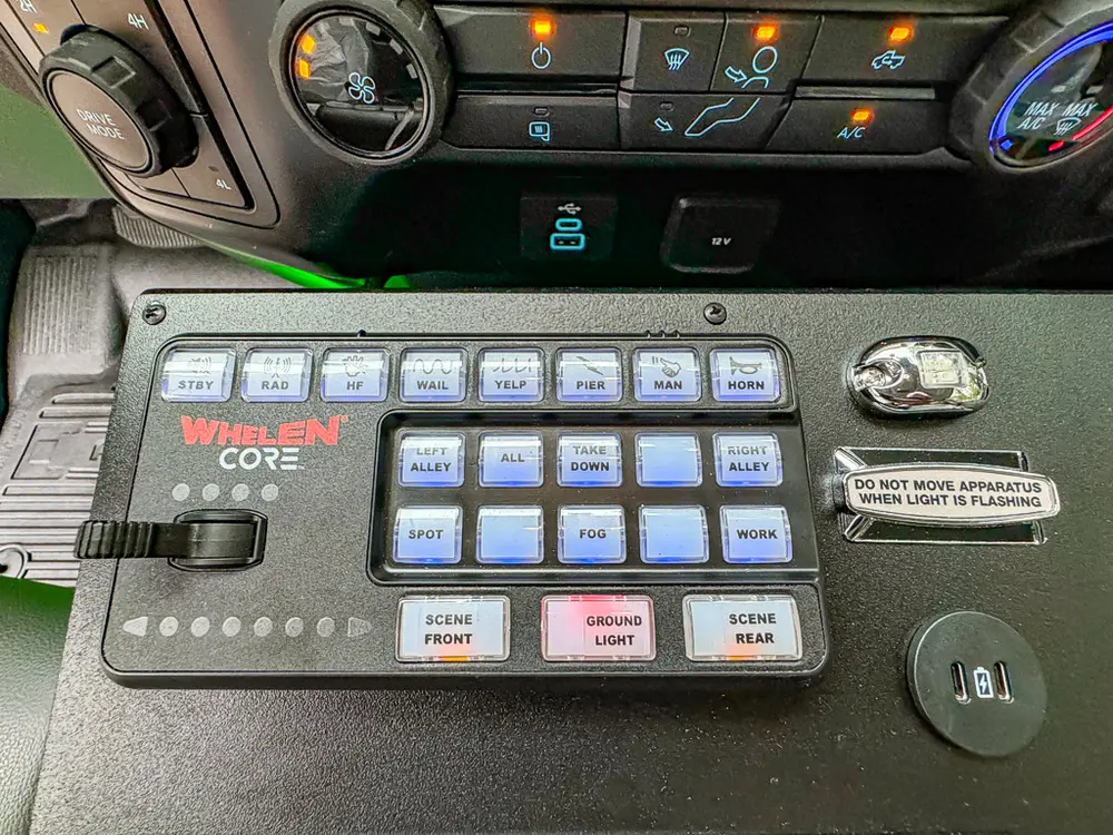 Whelen control keypad close-up mounted on center console.