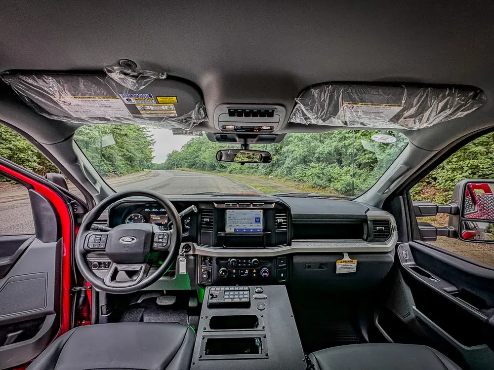 Wide front cabin interior view showing dashboard and console.