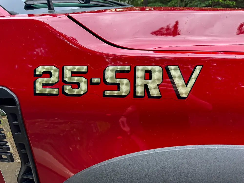 Side door lettering close-up reading 25-SRV.
