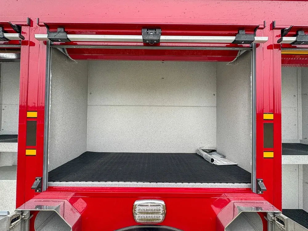 Open center side compartment with empty storage bay.