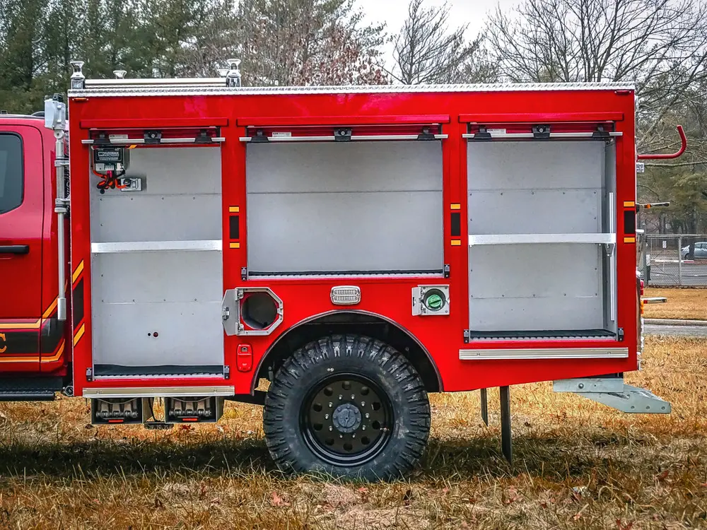 Left-side rear section close-up with open compartments and shelving.