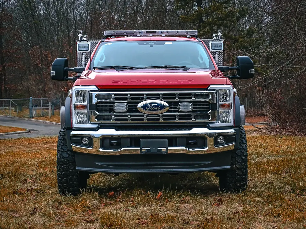 Head-on front view showing grille, headlights, and bumper.