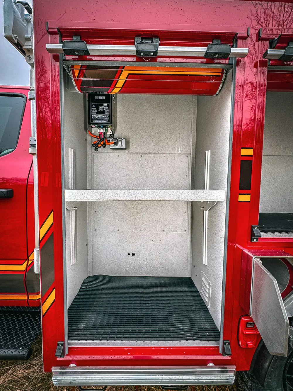 Open side compartment with two shelves and empty interior.