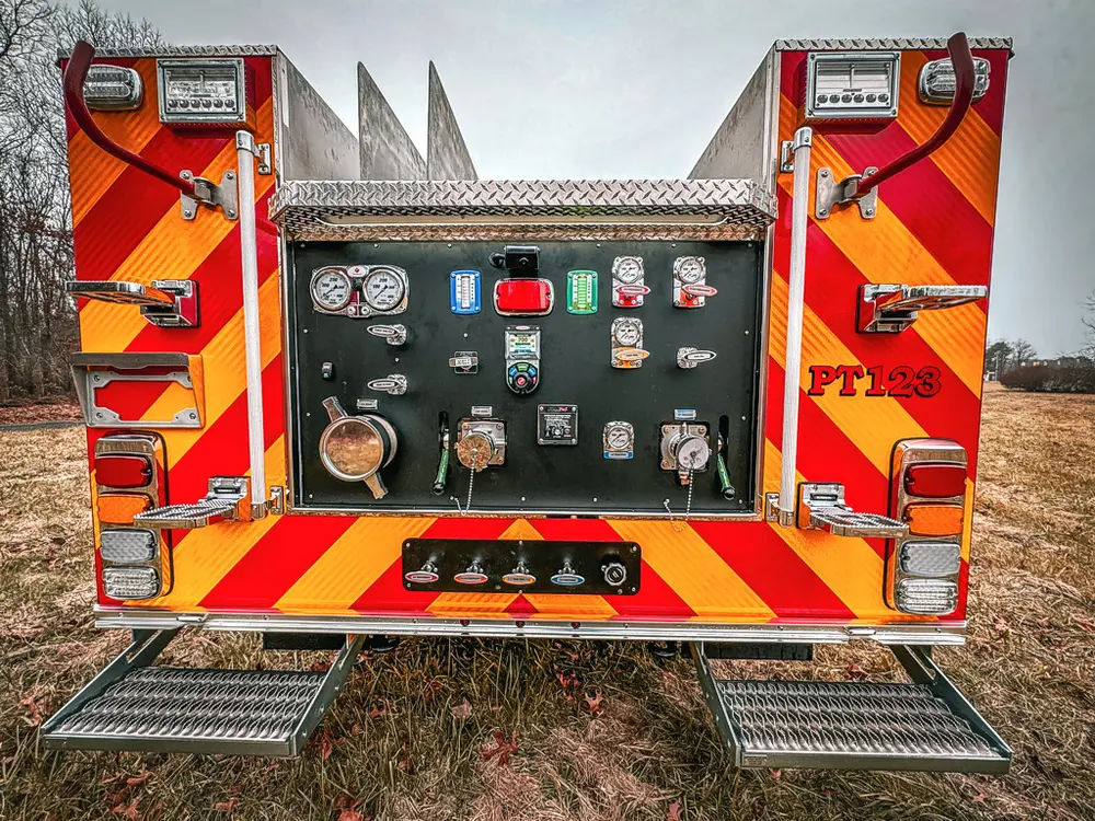 Straight rear view of the pump panel and chevron-striped rear body.