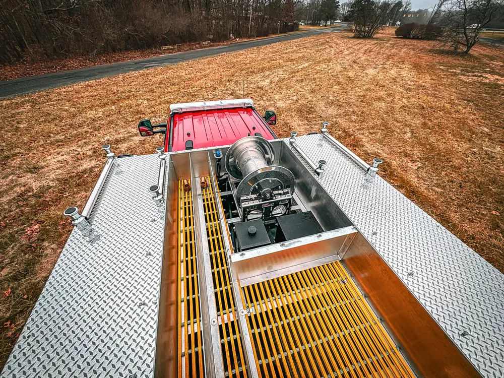 Top deck view showing center equipment bay and yellow grated walkways.