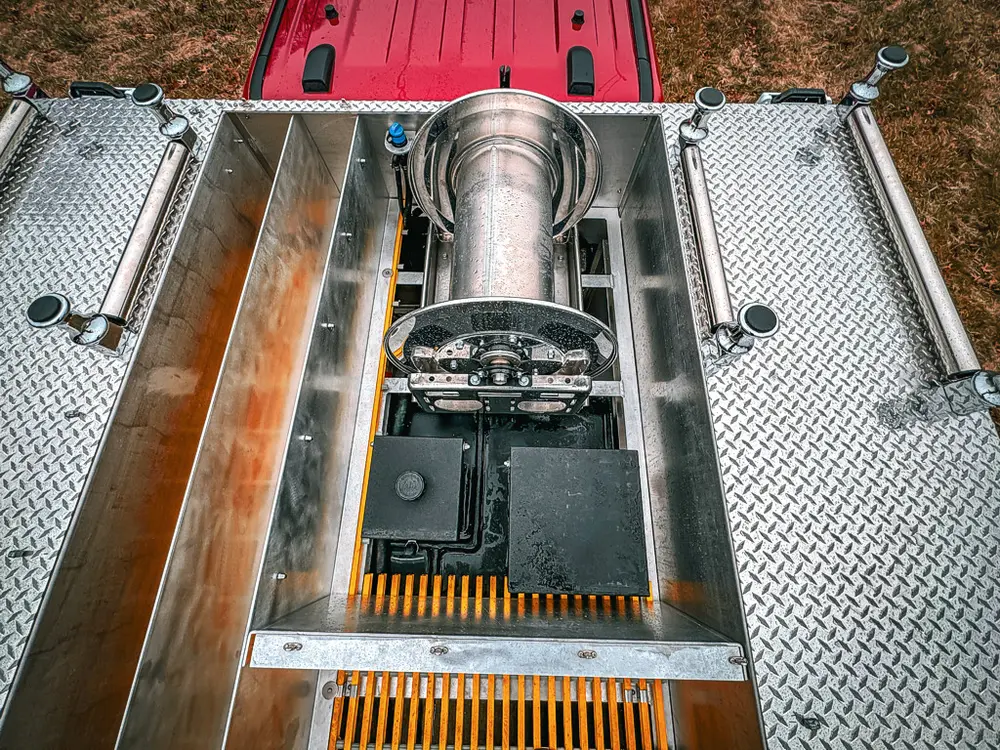 Top center equipment bay close-up with mounted reel assembly.