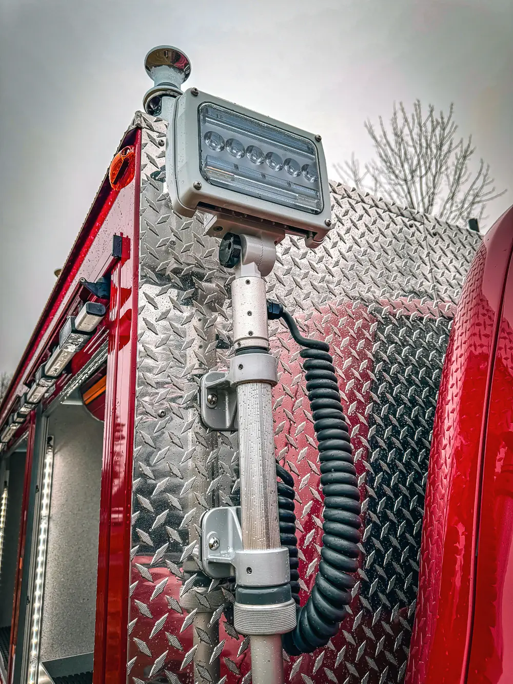 Upper rear corner close-up with mounted support strut and light bracket.