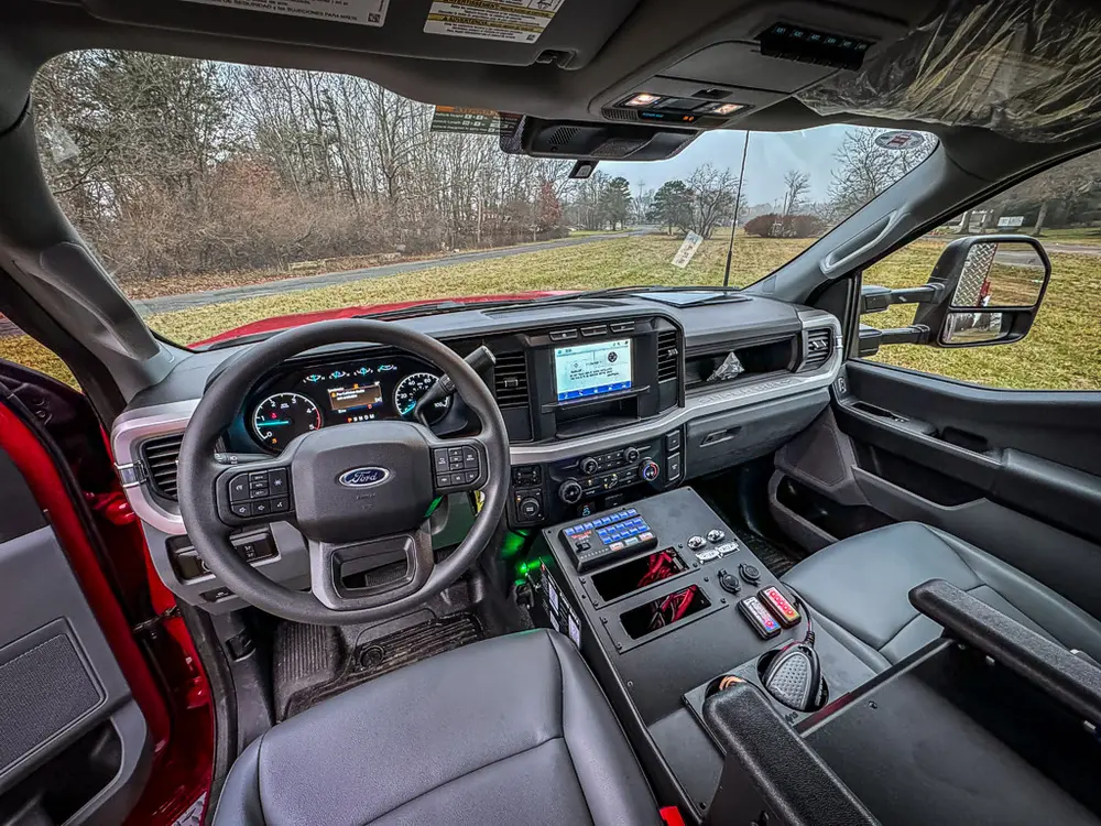 Driver cockpit view showing dashboard and central control stack.
