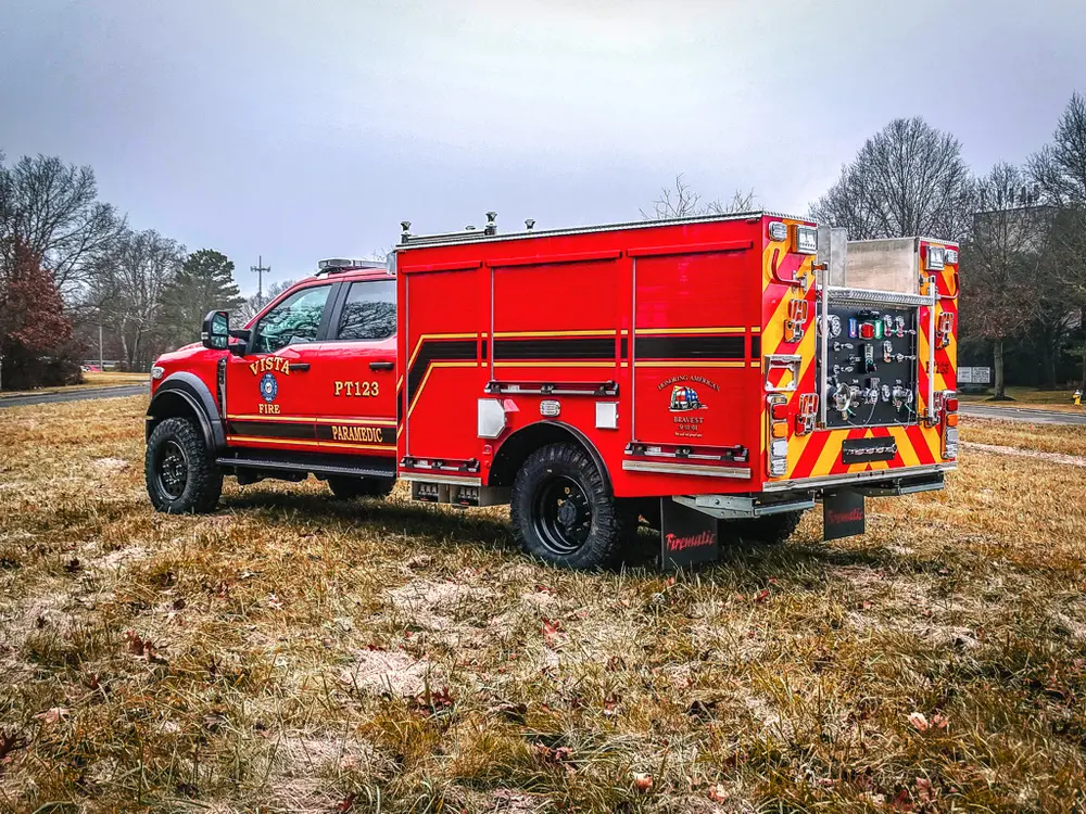 Rear-left three-quarter view with chevron rear panel visible.