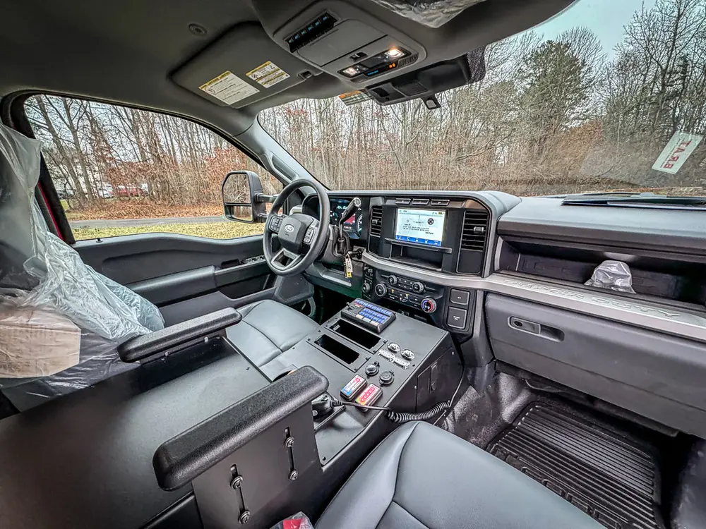 Front passenger interior view showing dashboard and center console.