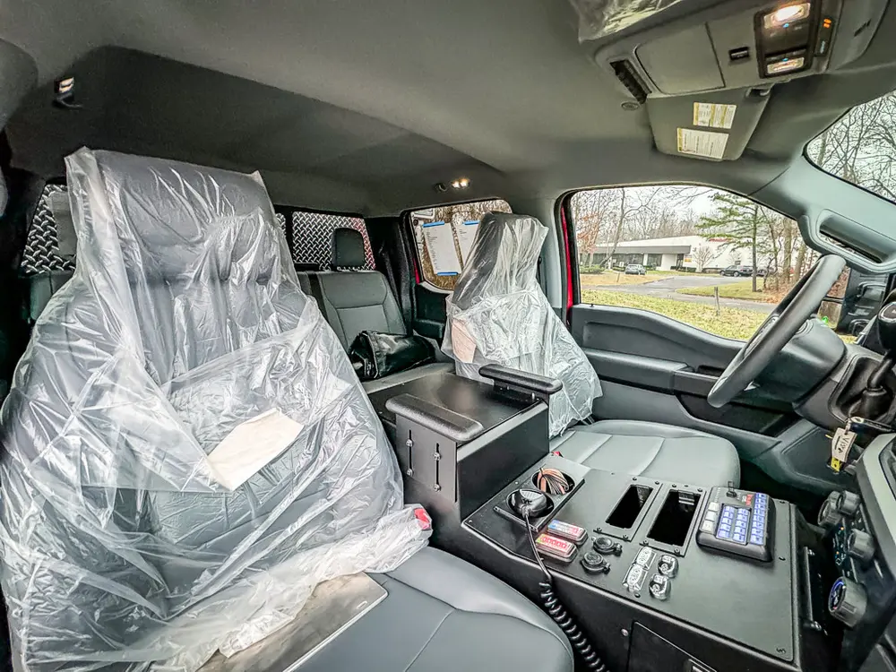 Passenger seat and center console close-up from side door.