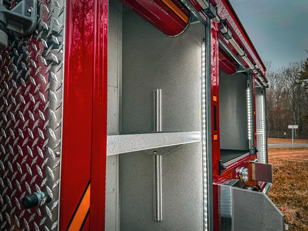 Open side compartment with shelves and clean empty interior.