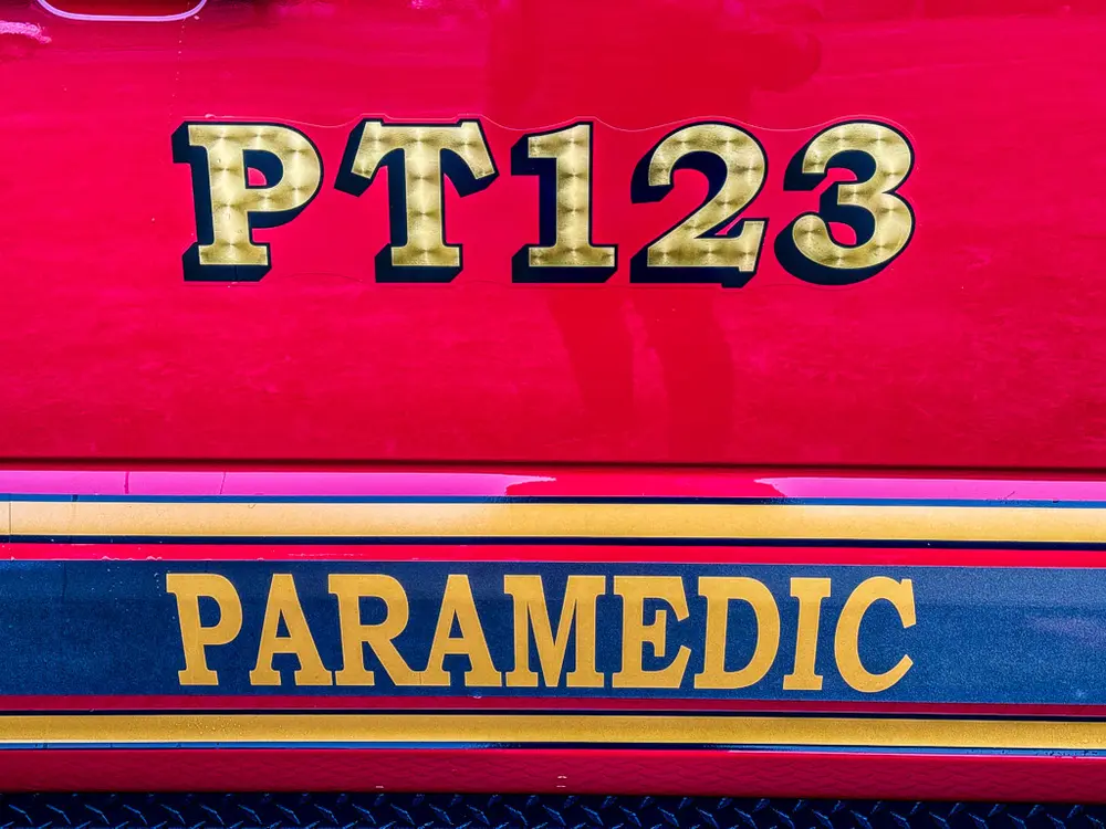 Side body lettering close-up reading PT123 and Paramedic.