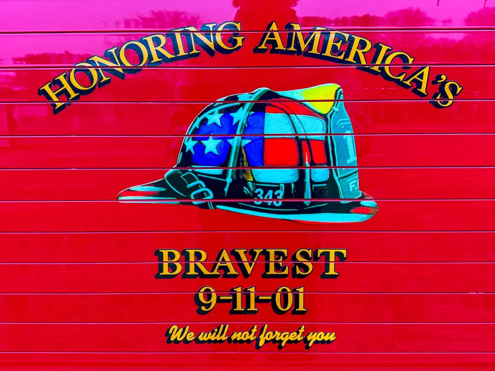 Decorative side panel graphic honoring America's bravest with helmet artwork.