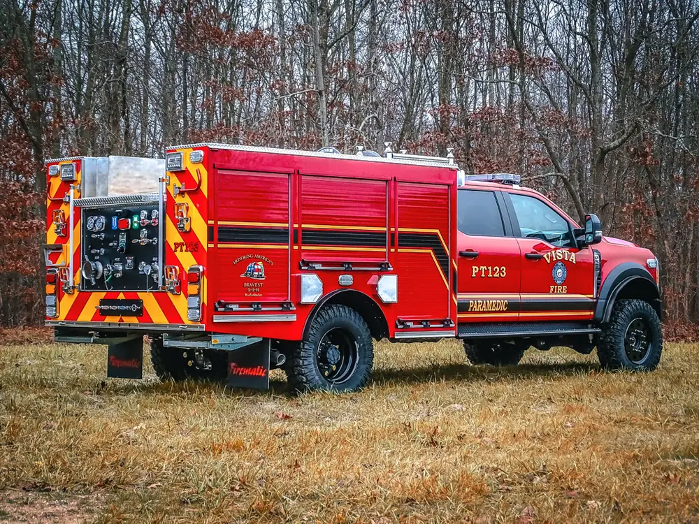 Rear-left side angle with side body and rear controls visible.