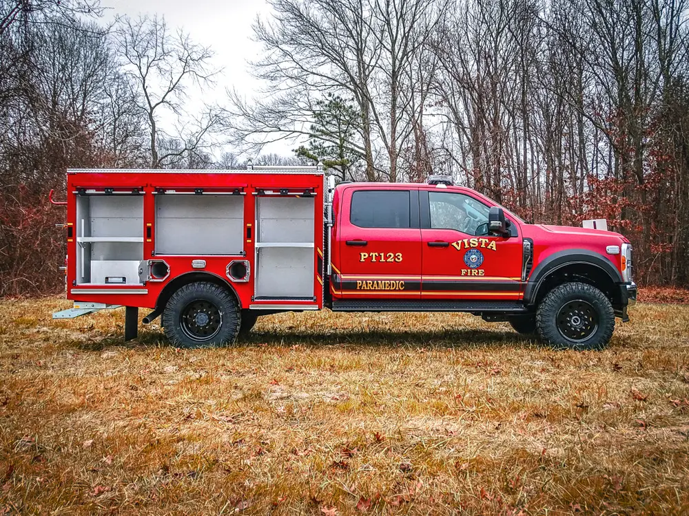 Left-side profile with multiple side compartment doors open.