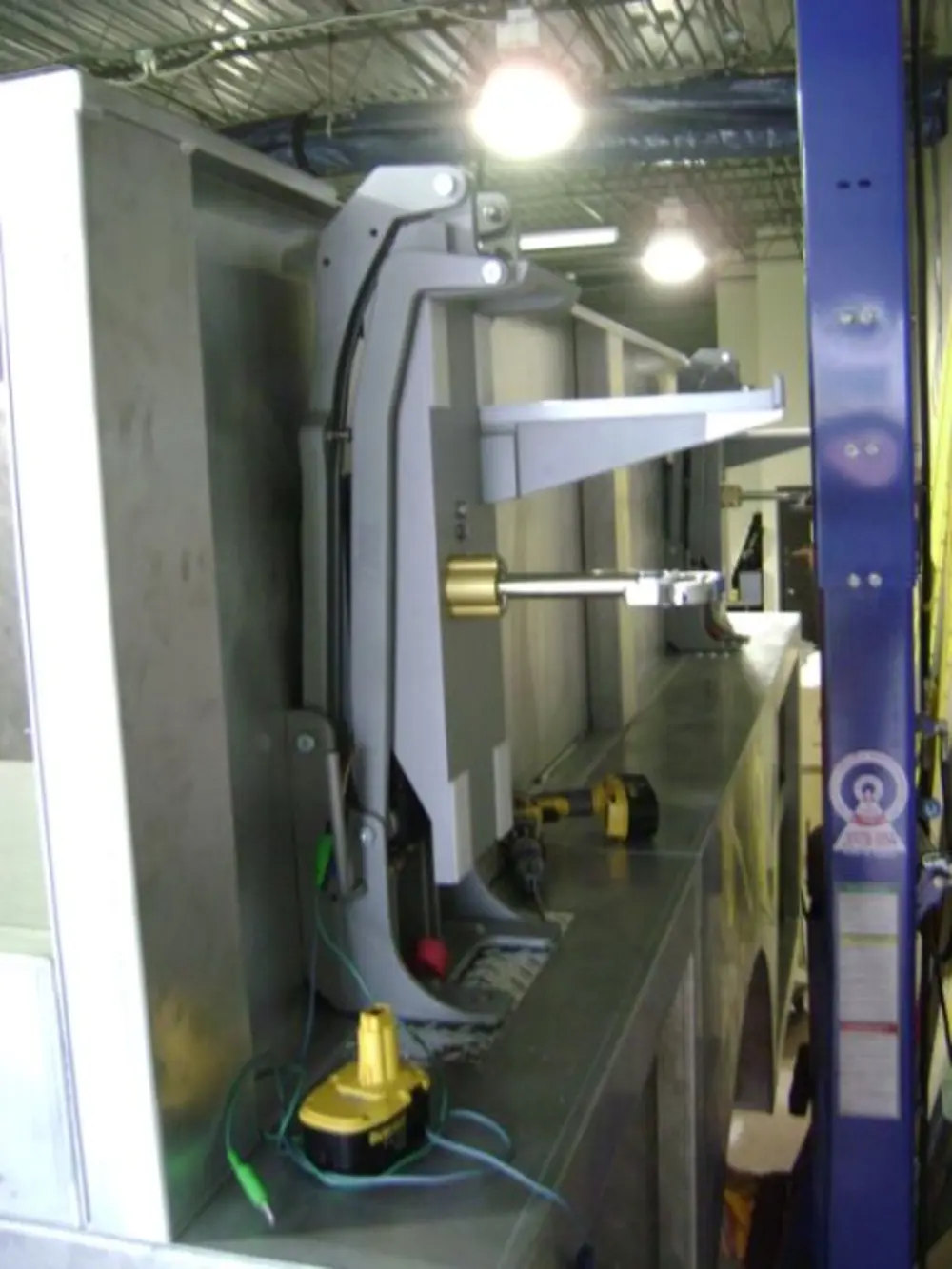 Exterior view of small fire truck showing cab, body compartments, and wheel/tire area.