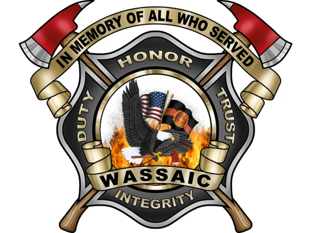 Exterior view of small fire truck showing cab, body compartments, and wheel/tire area.