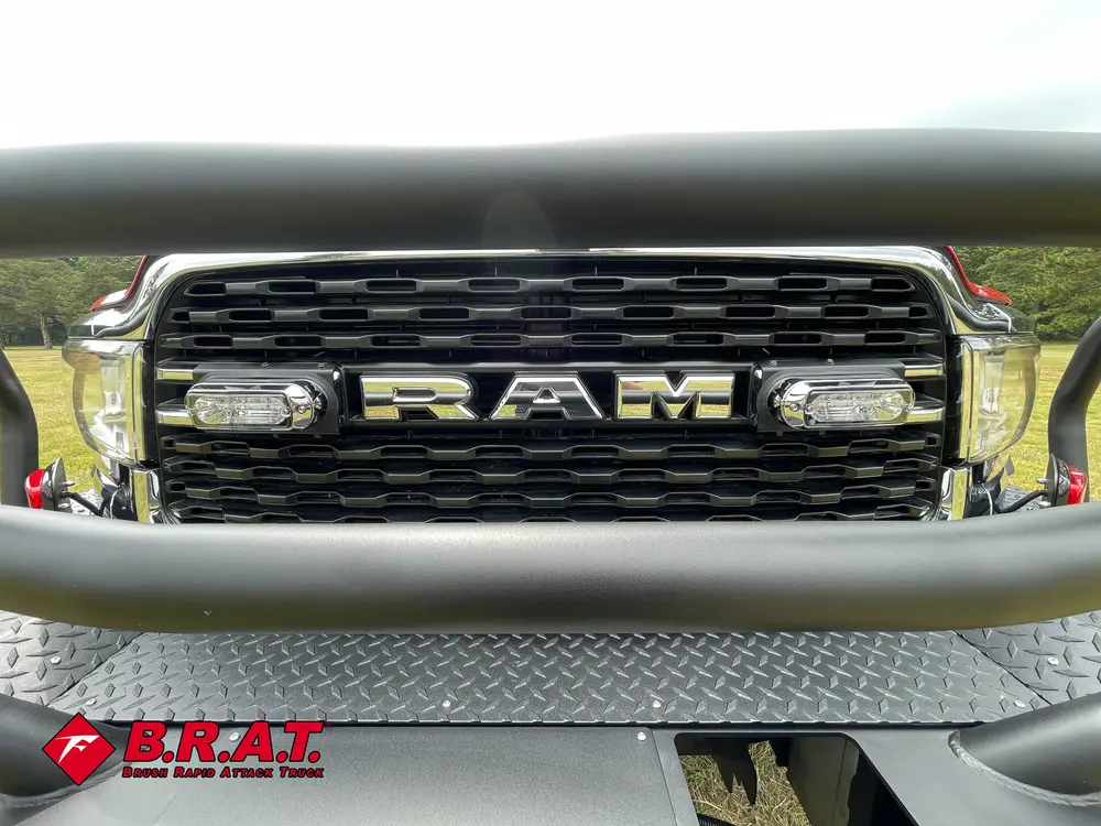 Front grille close-up with RAM lettering and center light module.