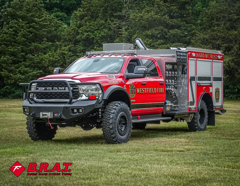 Front-left exterior angle showing grille, roof lights, and side compartments.