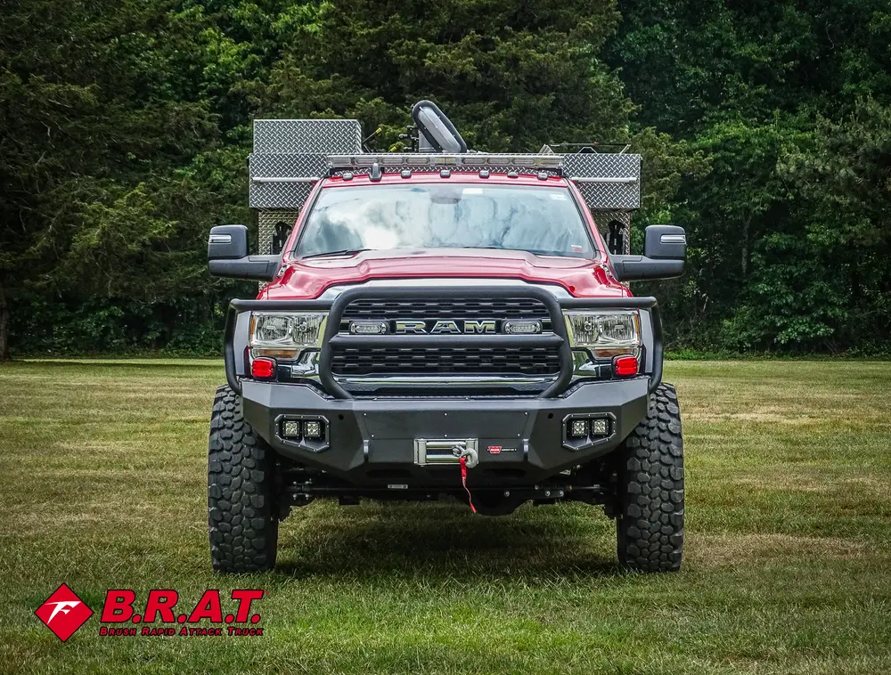 Head-on front view with grille, bumper, and front winch area.