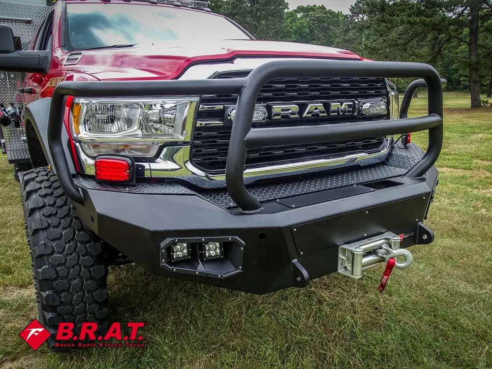 Front bumper and grille close-up with brush guard and winch fairlead.
