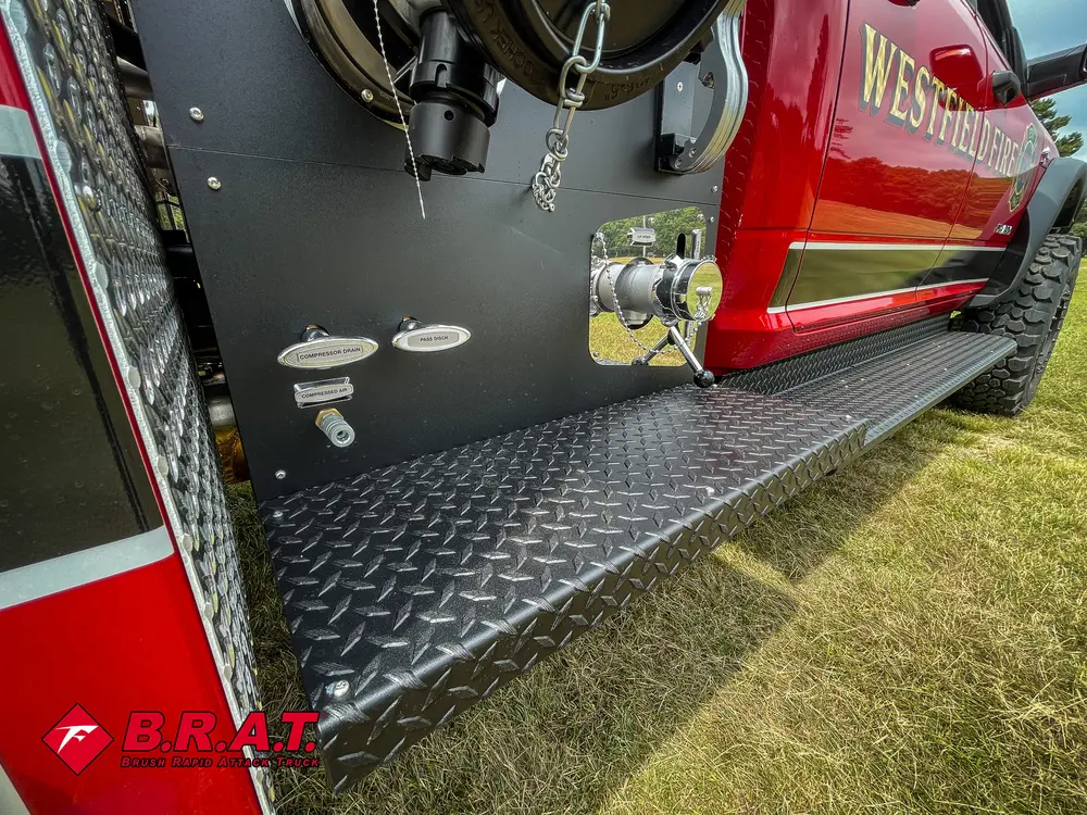 Side pump panel view with intake ports and mounted hose fittings.