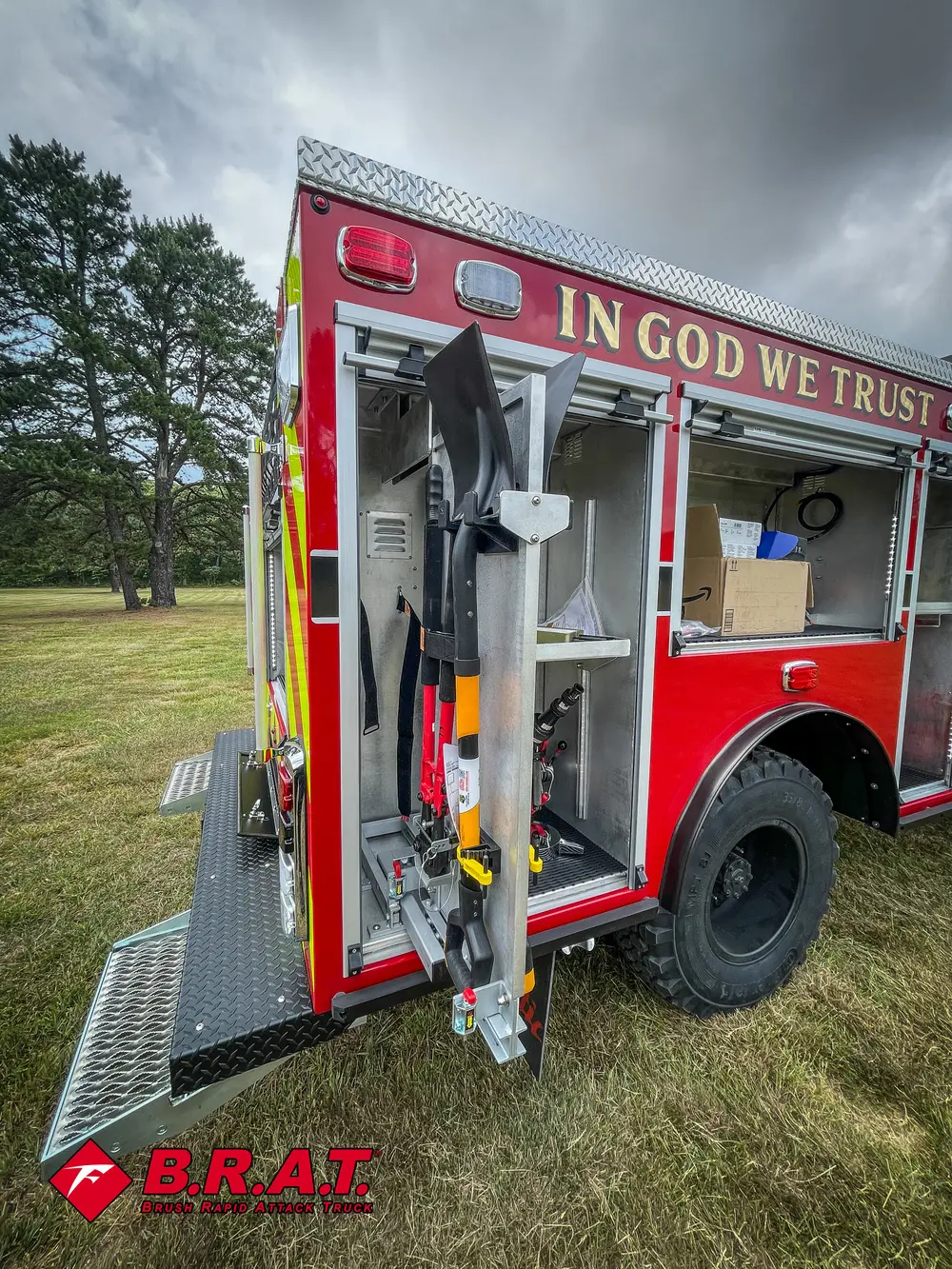 Open side compartment view with rear wheel and vertical tool storage.